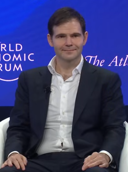 Jonathan Ross, founder of Groq, seated on a panel at the World Economic Forum Annual Meeting 2025