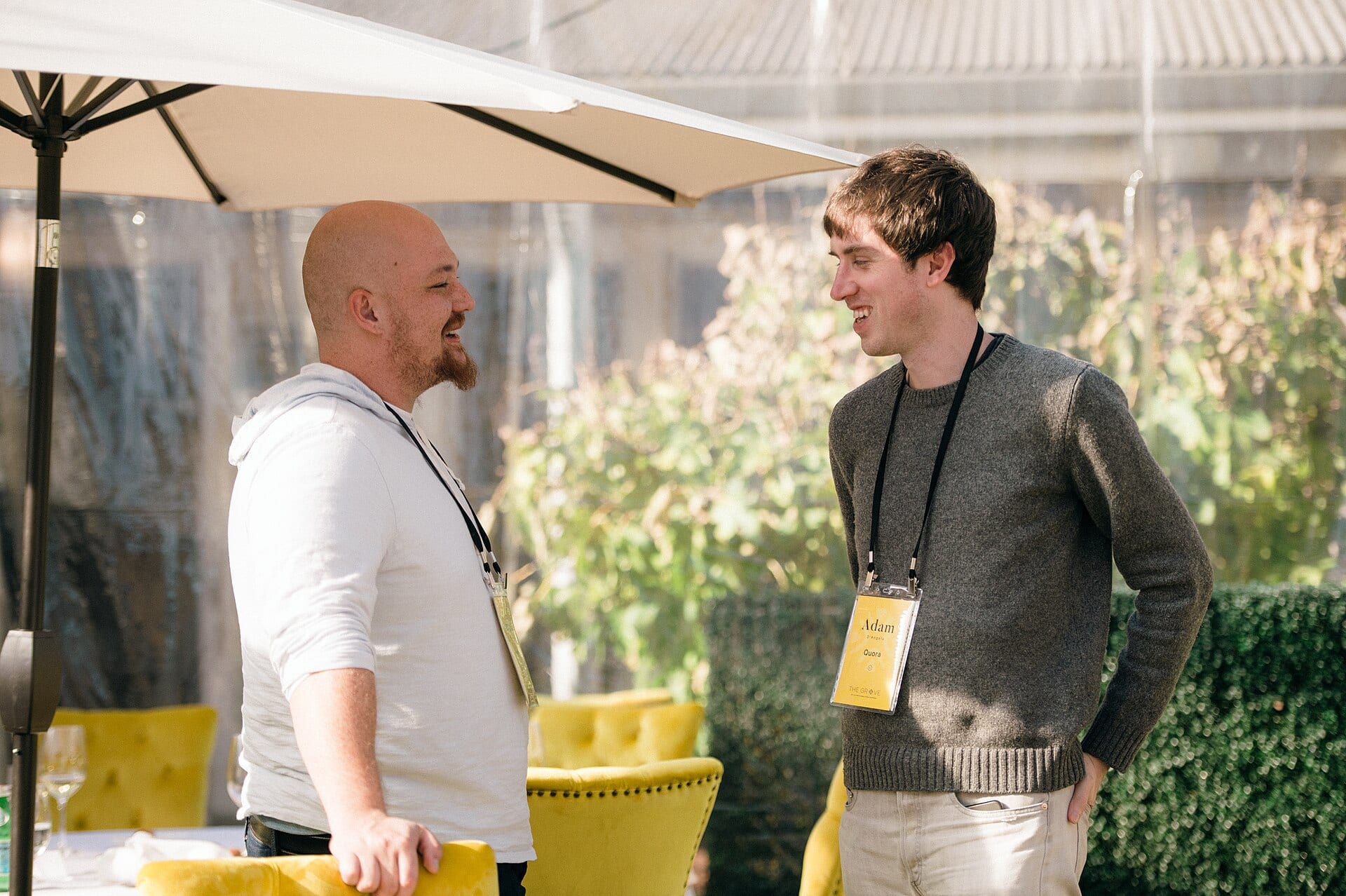 Amjad Masad, co-founder and chief executive of Replit, talking with Adam D'Angelo of Quora at a Village Global conference in 2022