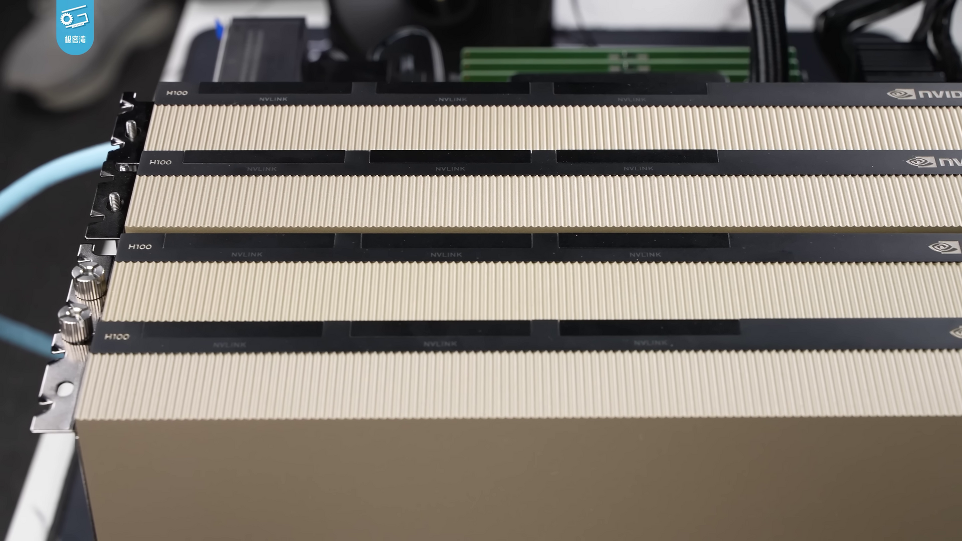 An Nvidia H100 accelerator standing on a white surface against a black background