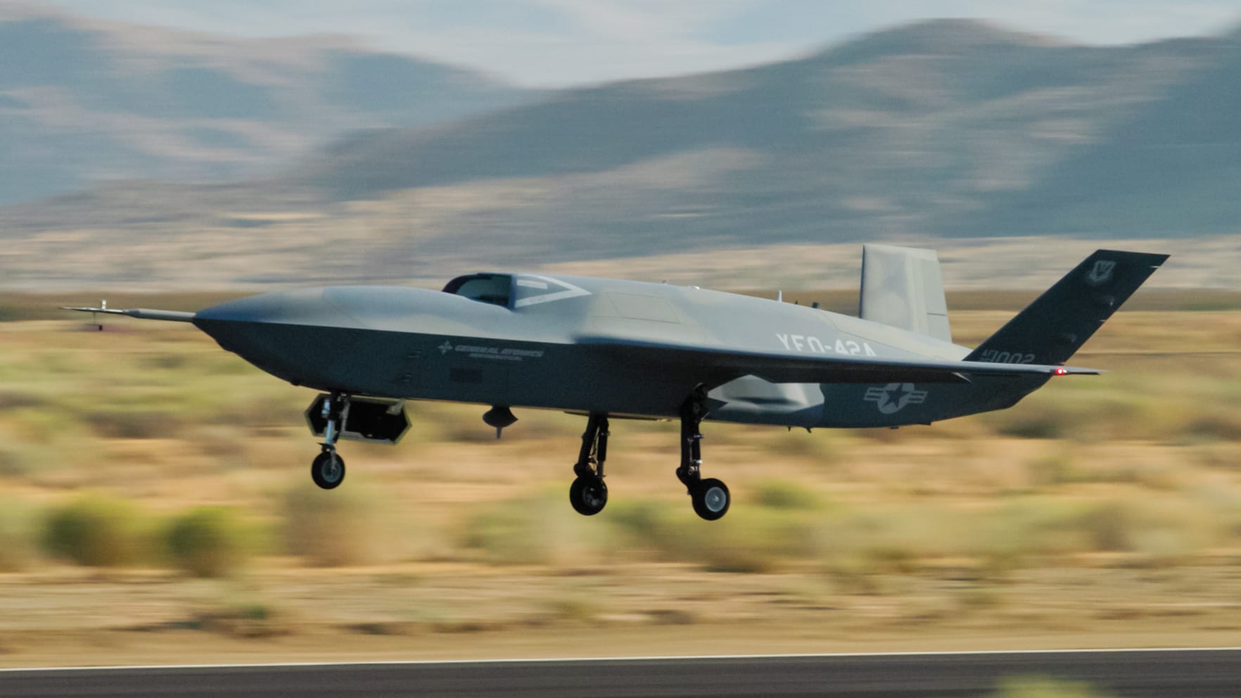 General Atomics' YFQ-42A climbing away just after lift-off during a flight test in California