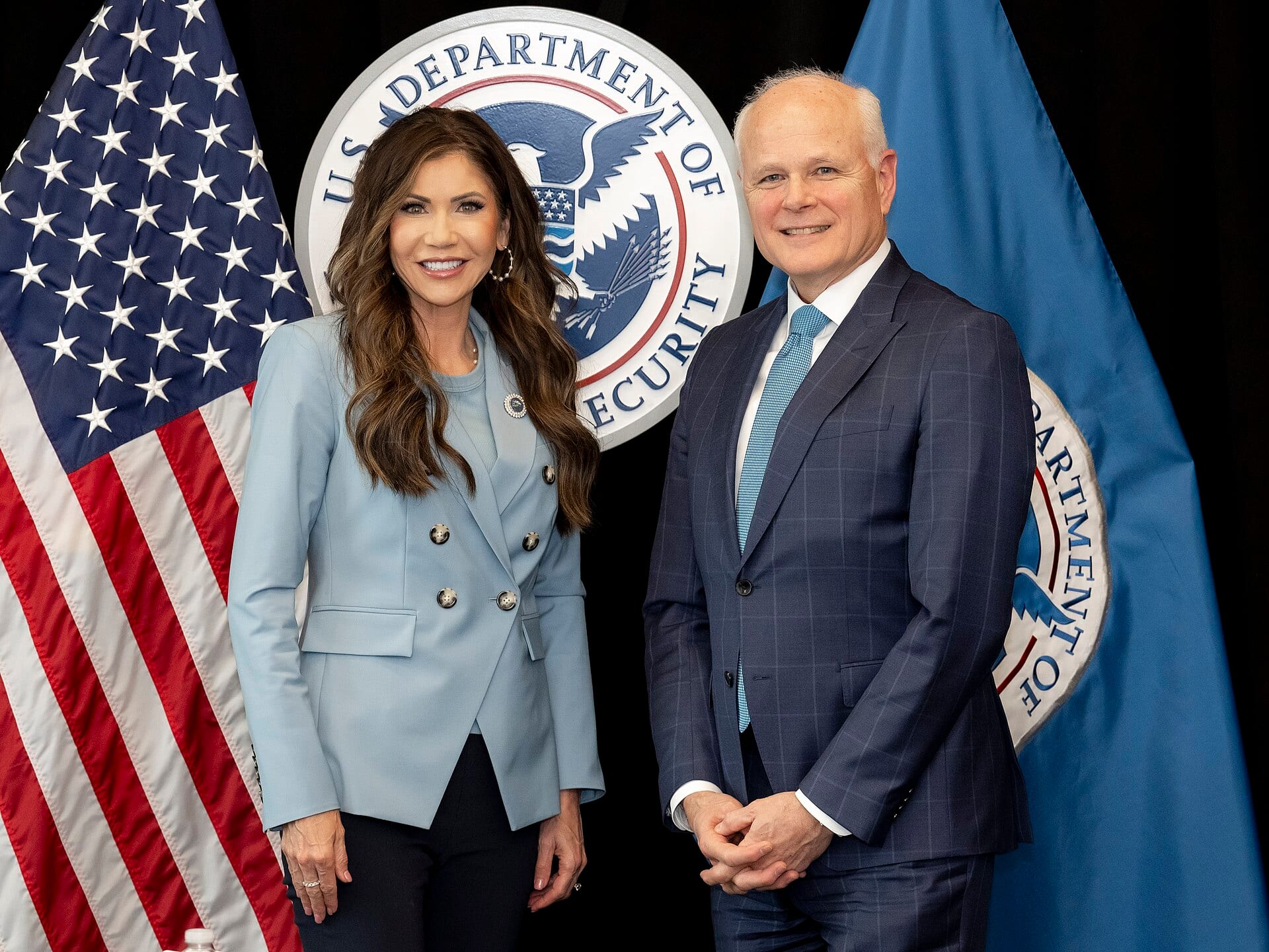 Leidos chief executive Tom Bell, right, at the Department of Homeland Security in Washington, D.C.