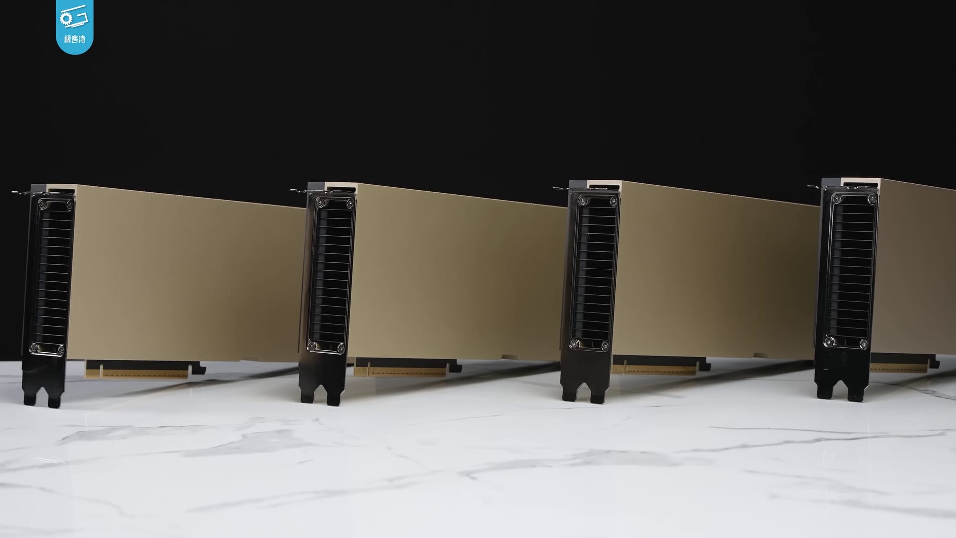 Four Nvidia H100 data center GPUs standing in a row against a black background