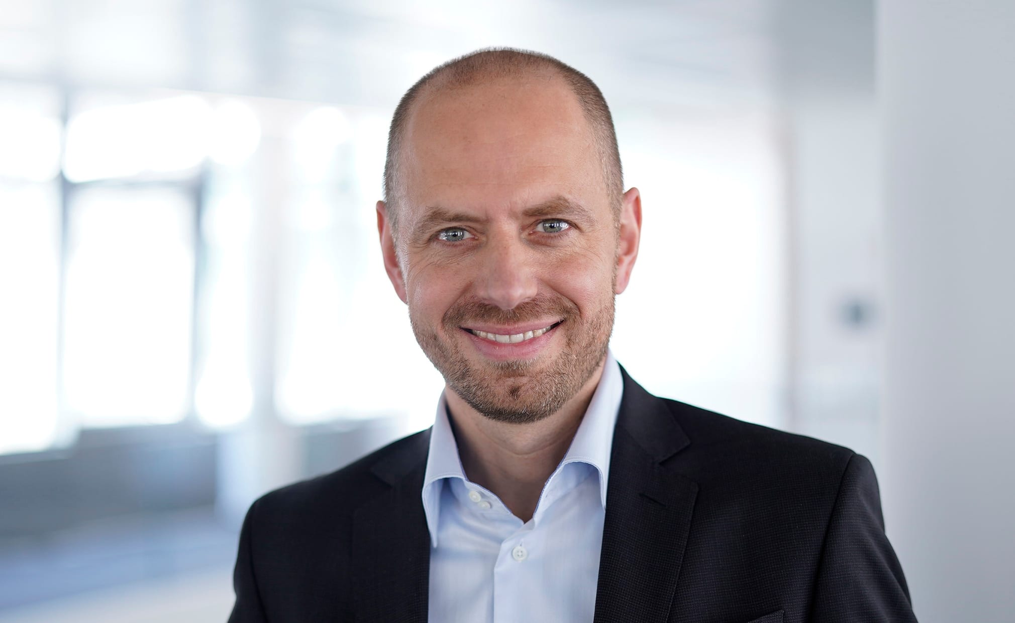 Christian Bruch, chief executive of Siemens Energy, in a dark suit and open-collar shirt