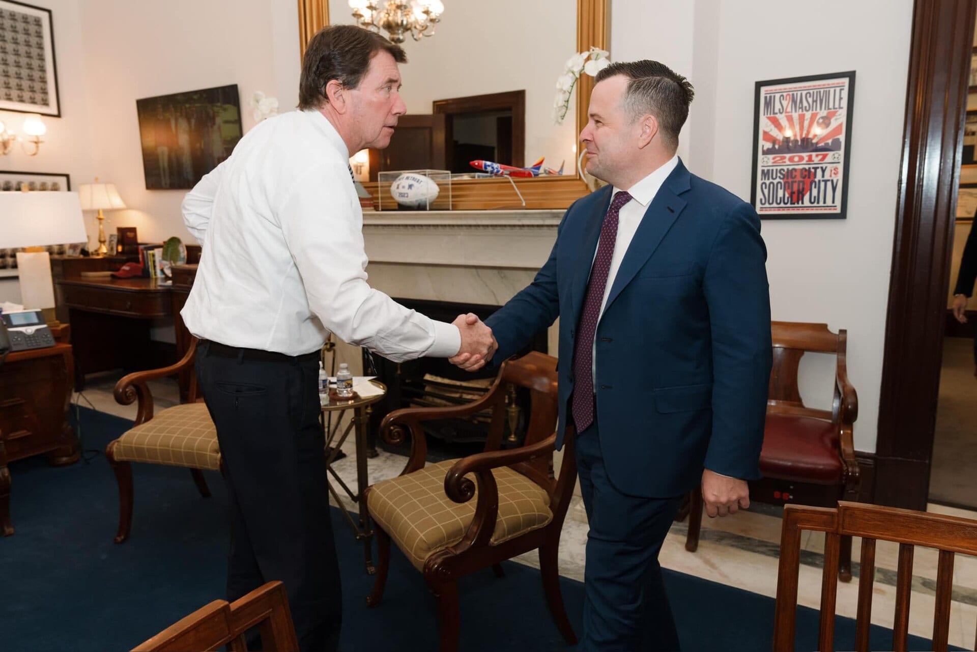 Bill Pulte, in a blue suit, shakes hands with Senator Bill Hagerty in a Capitol Hill office in February 2025, while his nomination to lead the Federal Housing Finance Agency was pending