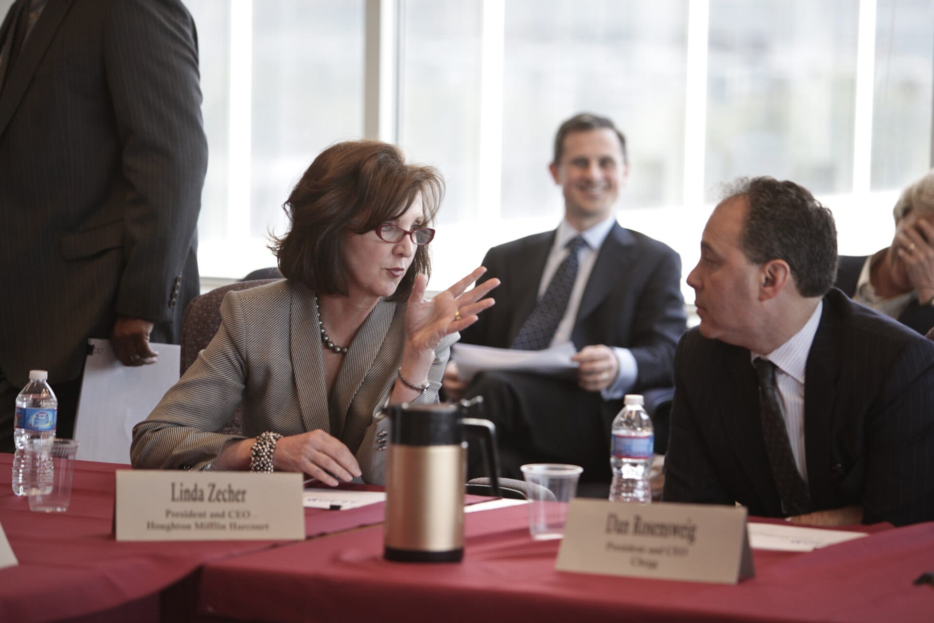 Dan Rosensweig, president and CEO of Chegg, seated at a table at an FCC digital education roundtable, his name placard in front of him