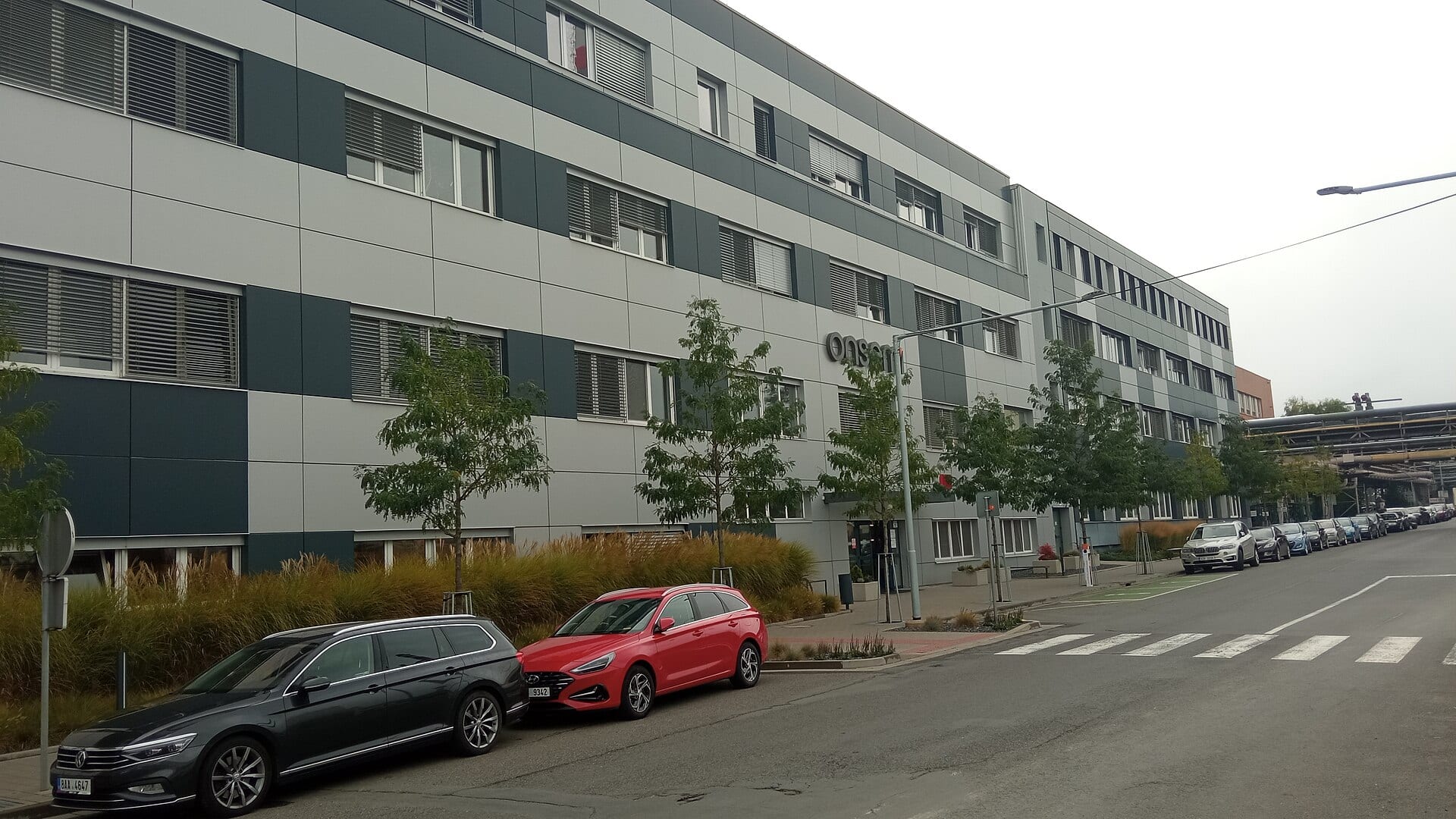 The onsemi plant in Rožnov pod Radhoštěm, Czech Republic, a low grey industrial building with the onsemi logo on its facade.