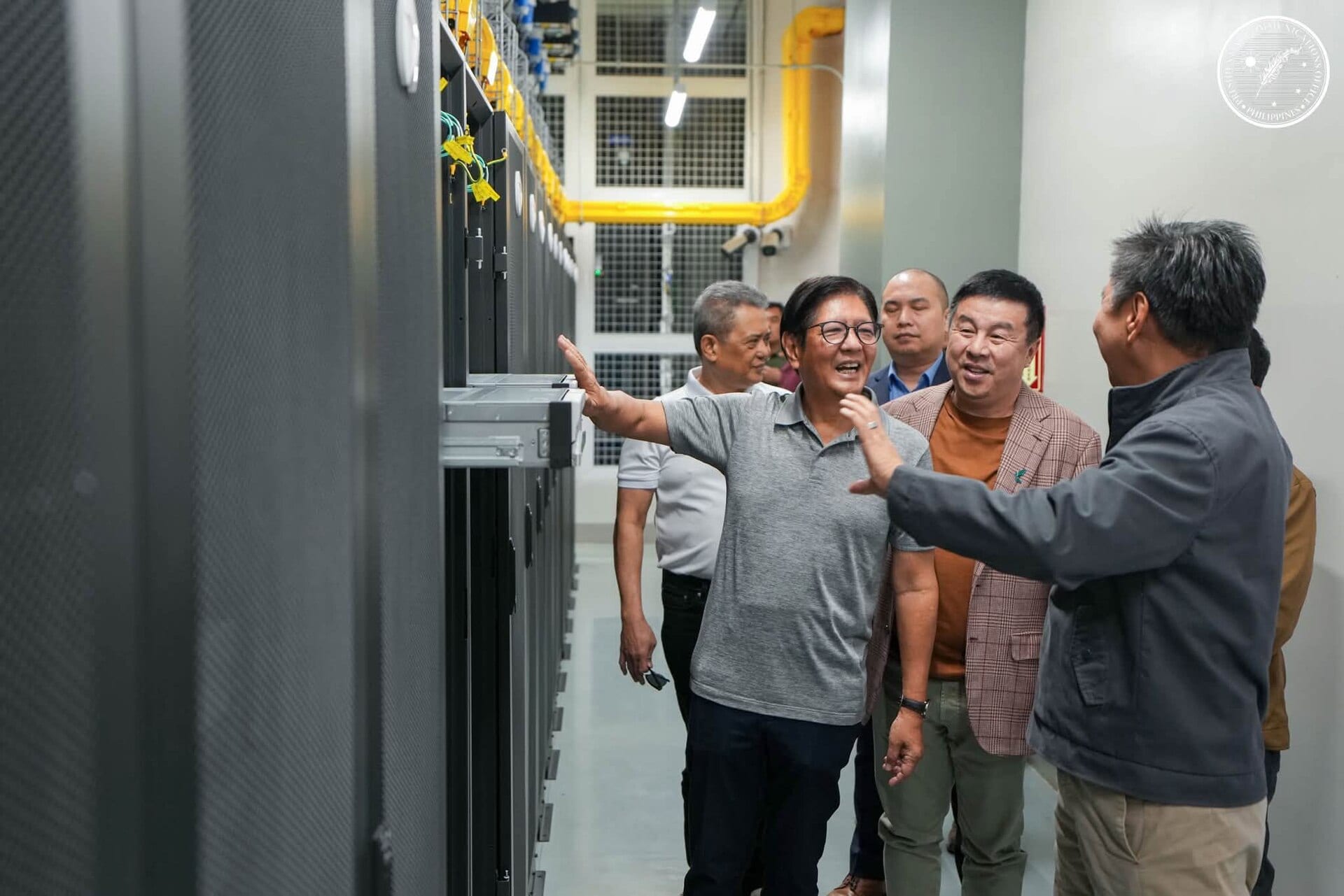 Officials inspect server racks at a Philippine government digital infrastructure event