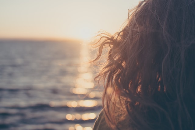 Woman Looking Out To Sea