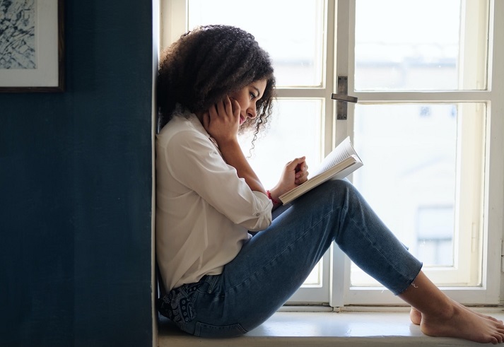 WomanReadingInWindow.jpg