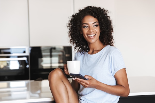 Woman with Mug and Phone