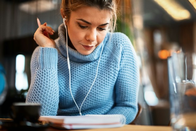 WomanWritingBlueJumper.jpg
