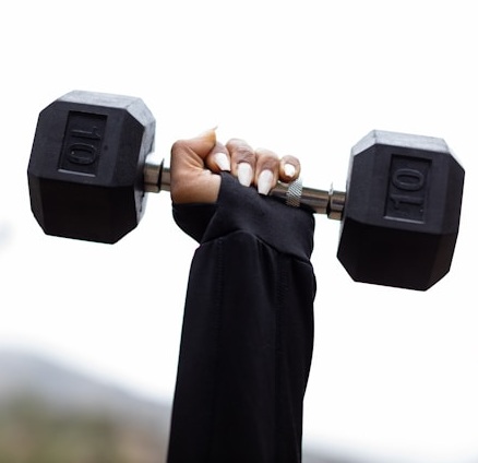 WomanHoldingWeightStock