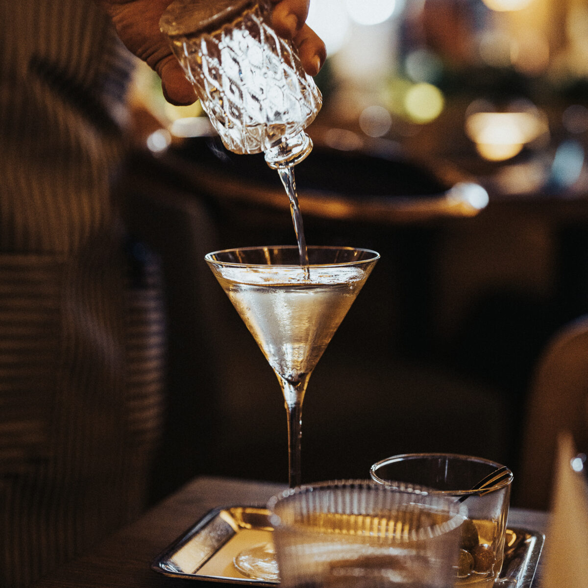 Shot of the Olive Oil Martini being poured