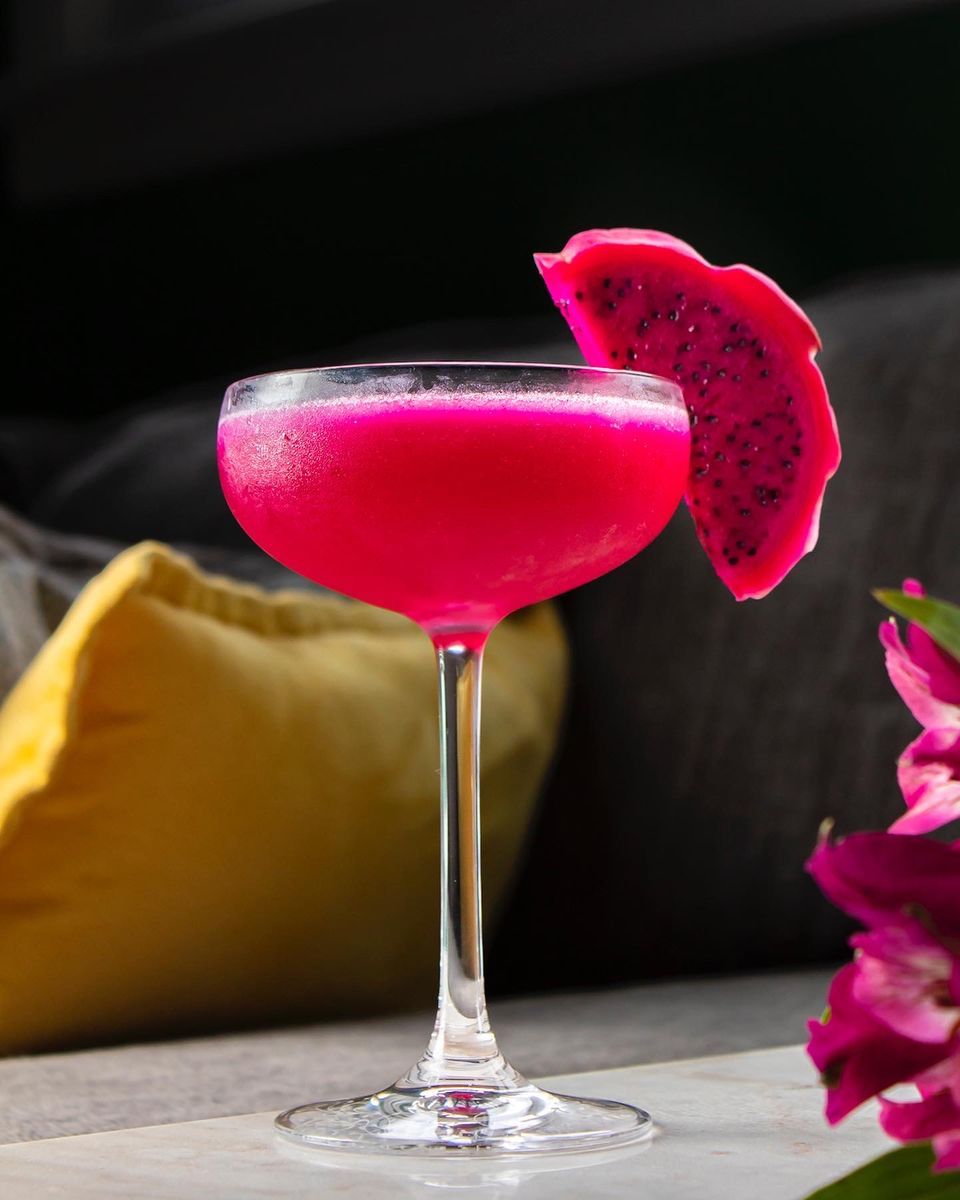 This cocktail is dedicated to my sister for her birthday! She’s a big fan of sweet, pretty coconutty drinks and I thought this would be the perfect balance! Pairing coconut rum with the delicious Ron Zacapa and bright pink Dragonfruit syrup and garnish was the right move, balanced by lime’s acidity and with a touch of Spiced Pear Liqueur to keep this a little on the autumnal side. This is a season straddler for sure but quite delicious and fairly complex and, I mean, come on, this color? Very mildly adjusted in post, it really is that freakin’ vibrant!