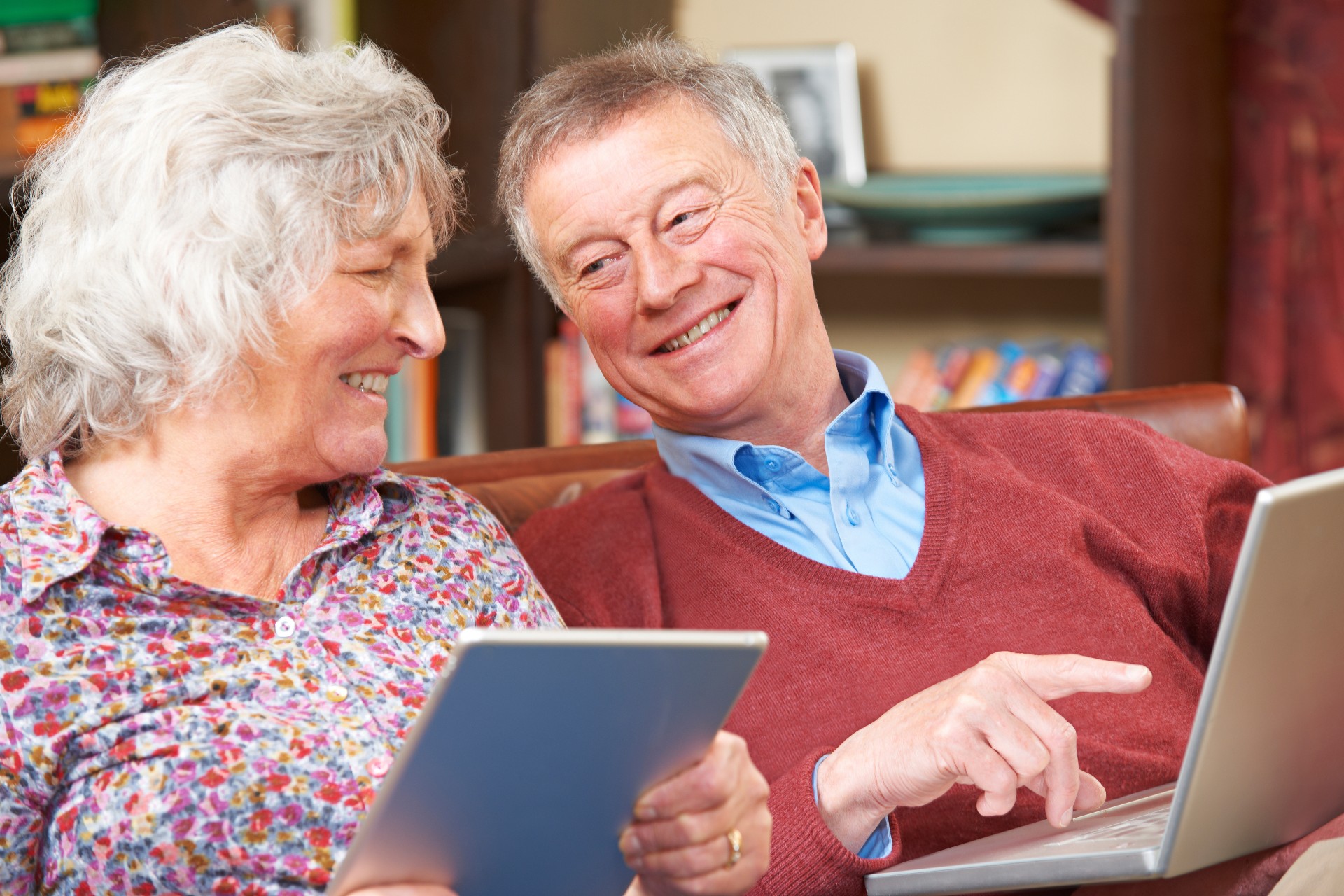 Happy senior couple looking at memory care options