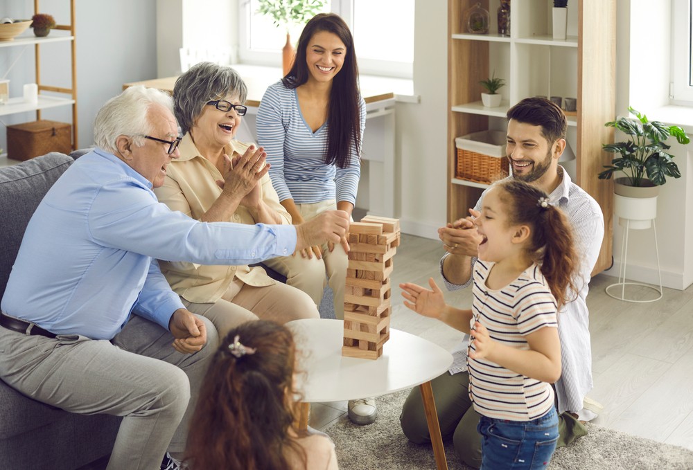 Seniors playing games with their family