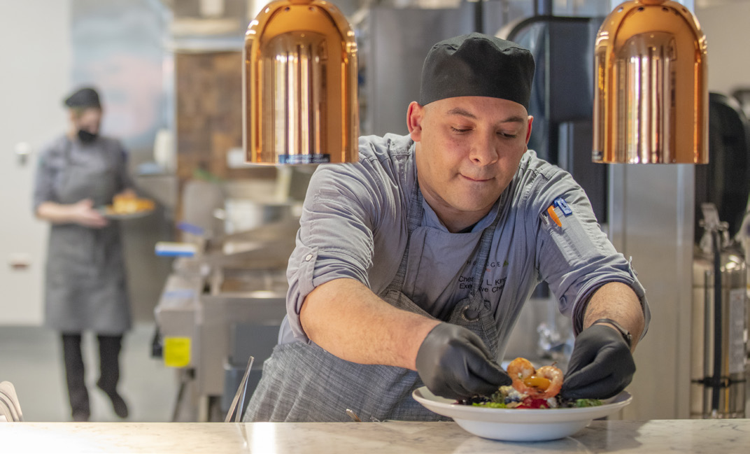 Executive chef preparing shrimp dish