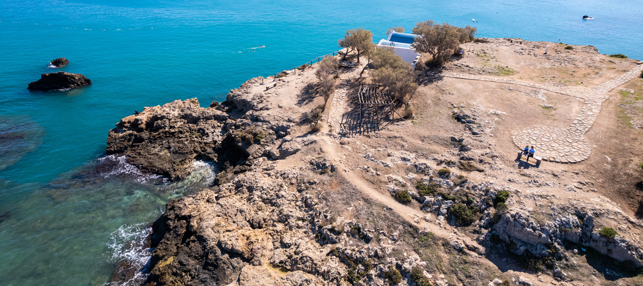 Drone photo of a small church next to the sea