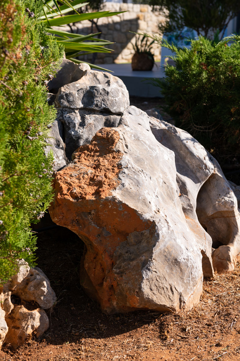 Rock in the yard of Theros Residence