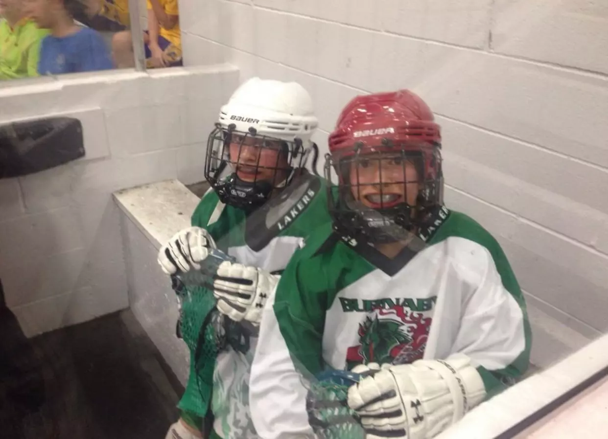 the Gaspar twins playing ice hockey.webp
