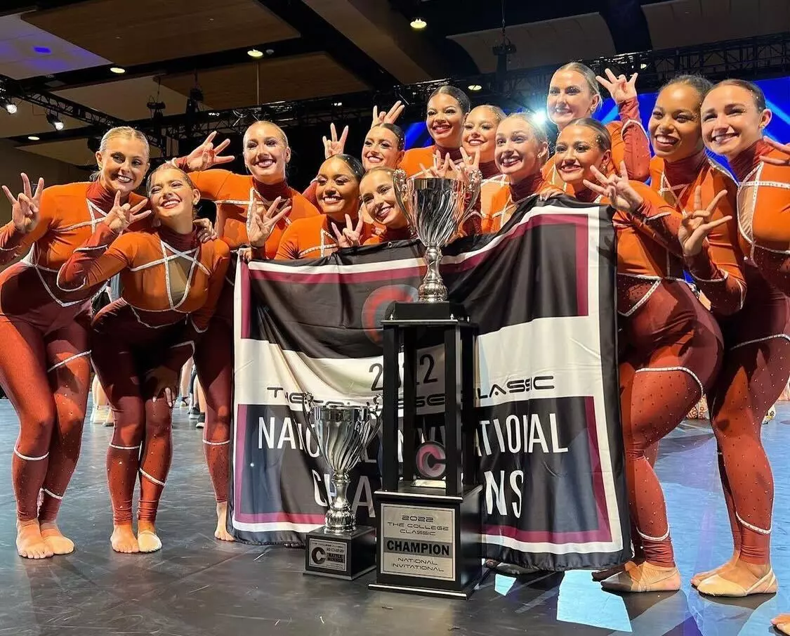Champion_Team_With_Trophy.webp