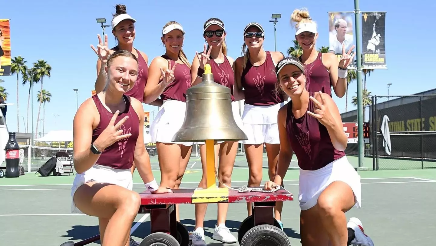 Women_Team_Posing_With_Trophy.webp