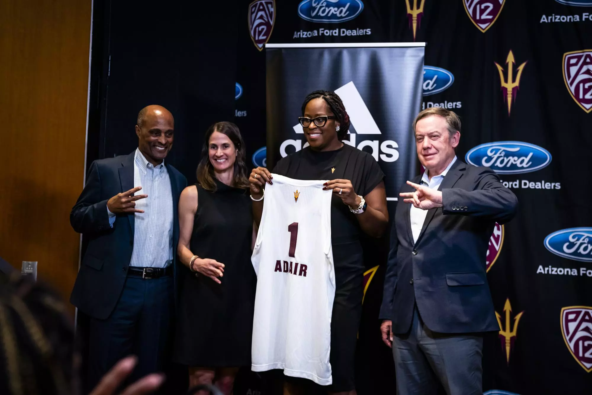 Coach-Adair-holding-jersey.webp