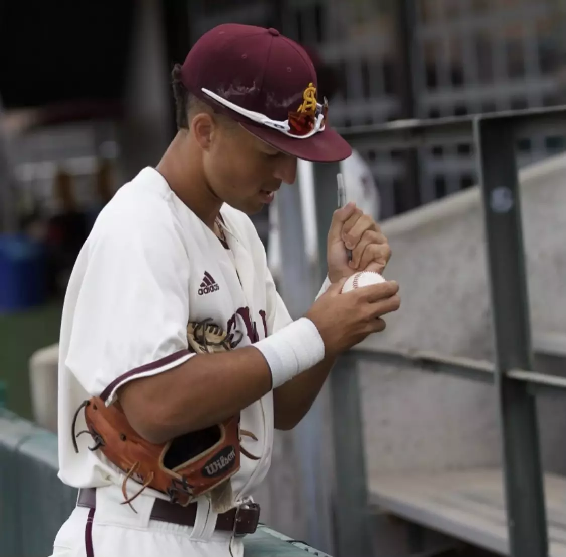 pitcher-signing-ball.webp
