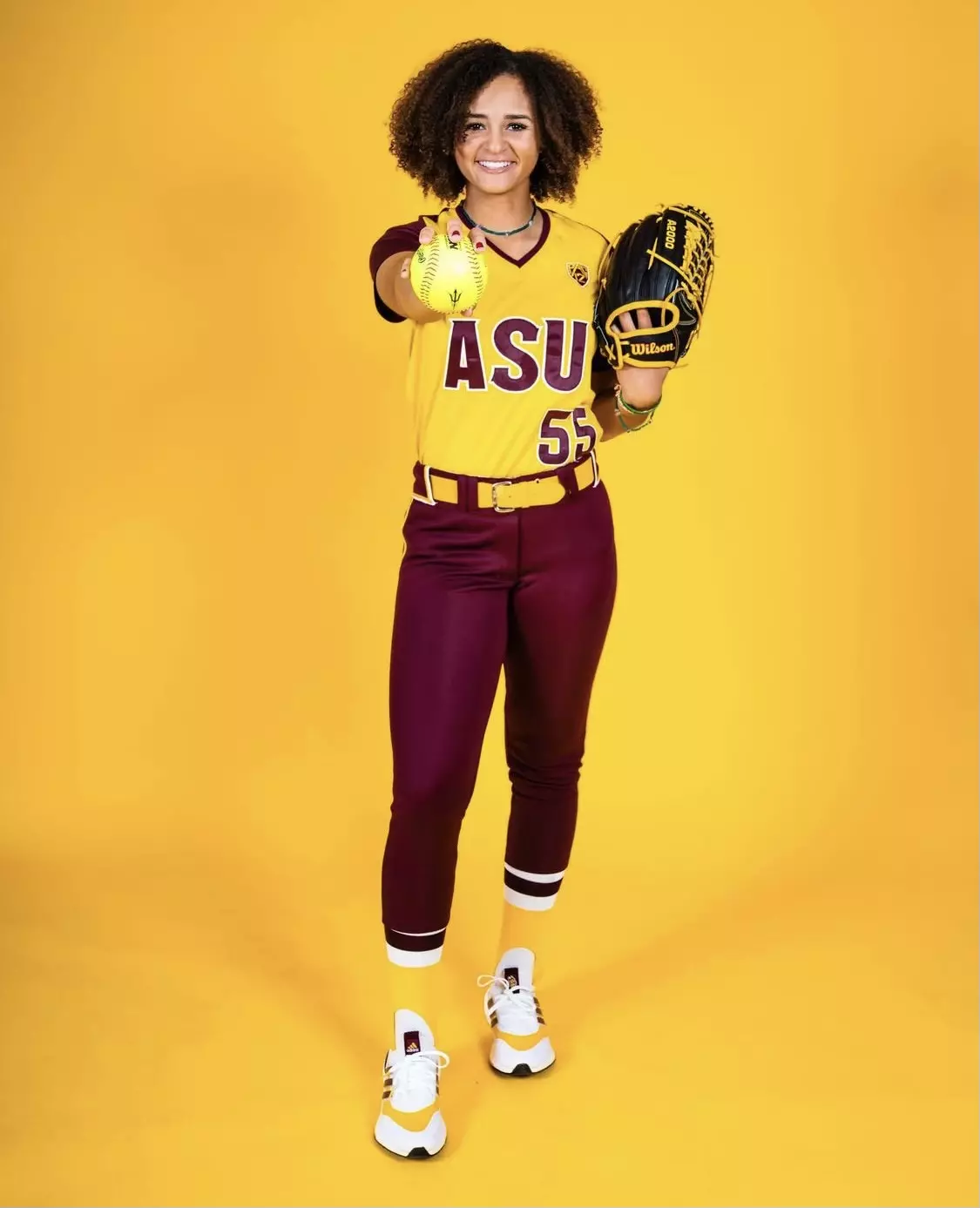 magee-posing-with-baseball.webp