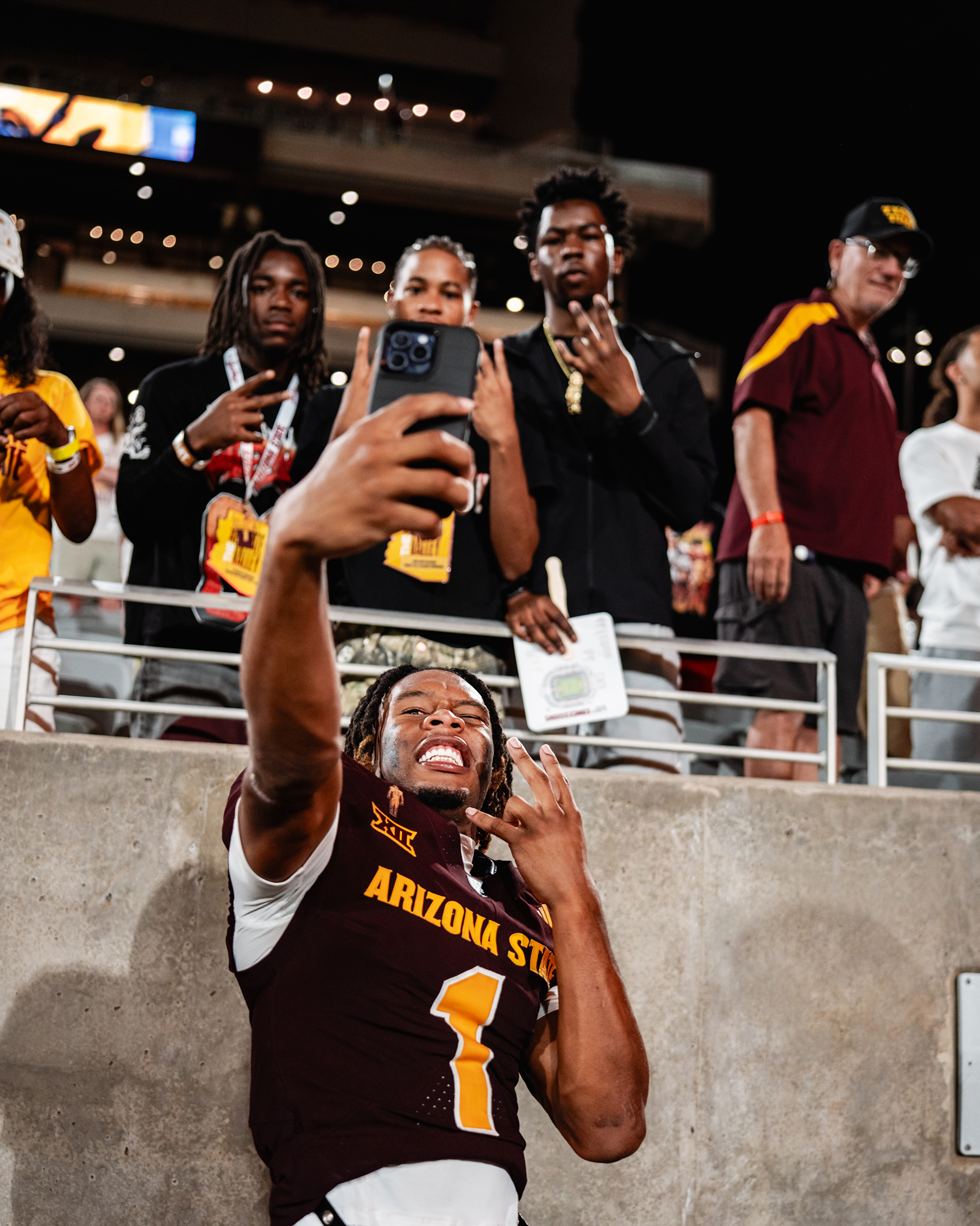 Keith Abney II taking photos with fans vs NAU-EJ 8.30.25