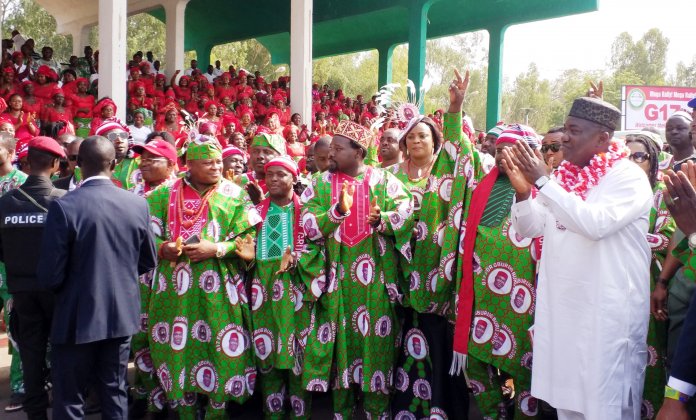 Governor Ifeanyi Ugwuanyi of Enugu State (right) acknowledging cheers from jubilant members of the G17 for Gburugburu 2019, during their mega rally for his re-election, held at Michael Okpara Square, Enugu