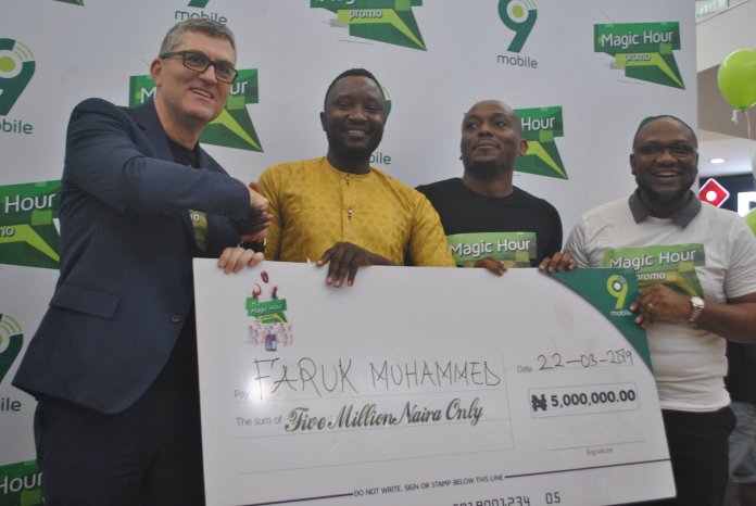 A Life Chnaging Win pix caption L-R: A.g Managing Director, 9mobile, Stephane Beuvelet; N5million prize winner of 9mobile Magic Hour Promo, Faruk Muhammed; Director, Regional Sale North, Tosin Olulana and Vice President, Marketing, Adebisi Idowu both of 9mobile, during the presentation to prize winners of the 9mobile Magic Hour Promo at the Jabi Lake Mall, Abuja