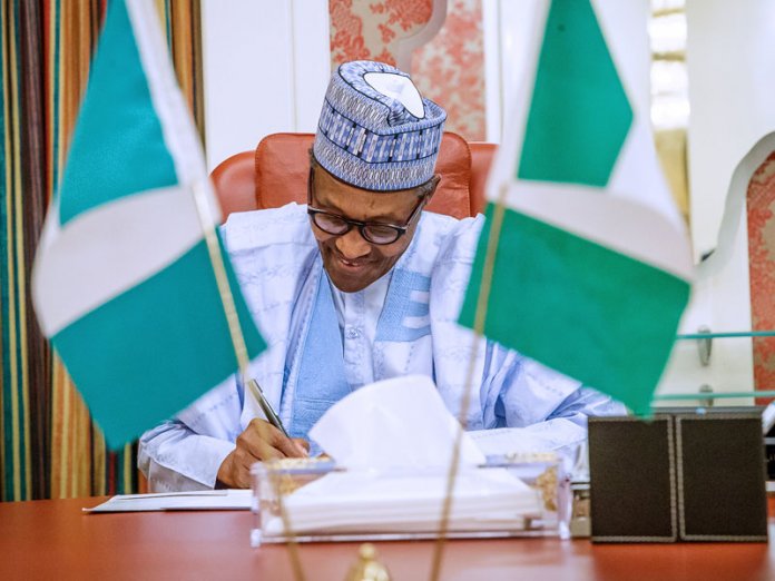 a63e3306 muhammadu buhari sign Buhari Govt Borrowed N12tr in Three Years, PDP Claims