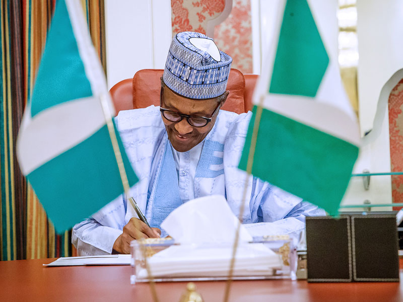 Image result for buhari signs 2019 budget