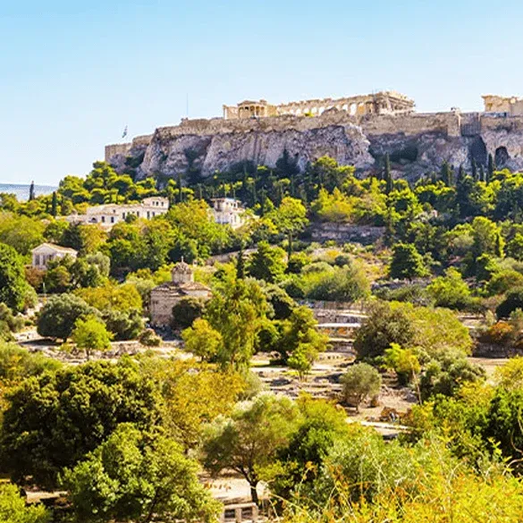 Panoramic view of the Acropolis of Athens dominating the city from its rocky hill.