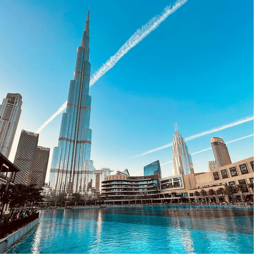 Burj Khalifa and Dubai Fountain Lake at Sunset