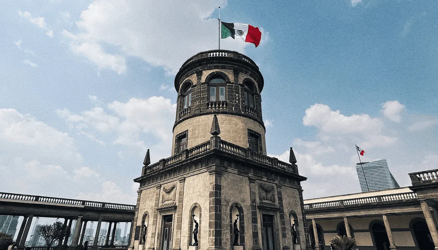 Facade of the central tower of Chapultepec Castle with the Mexican flag