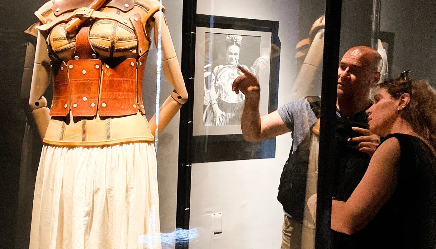 Visitors observing an exhibition inside the Frida Kahlo Museum