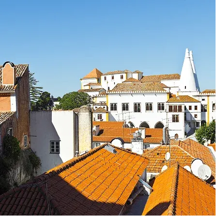 National Palace of Sintra with its distinctive white chimneys overlooking the rooftops of the historic center.