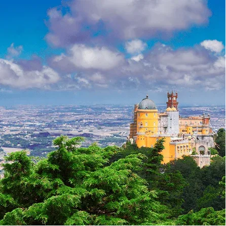 Colorful Pena Palace rising above the forests of Sintra, one of Portugal's most iconic UNESCO World Heritage landmarks.