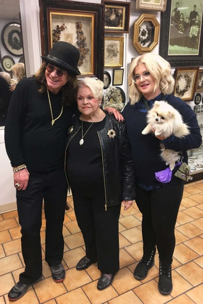 In this March 2018 photo provided by Lindsay Evans, Leila Cohoon poses with Ozzy and Kelly Osbourne at Leila’s Hair Museum in Independence, Miss. (Lindsay Evans via AP)