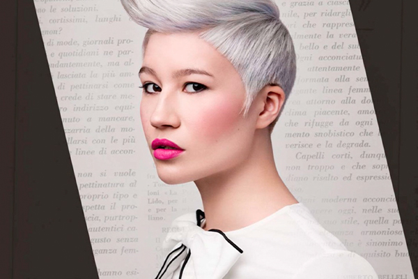 Woman with white and light purple hair looking at the camera