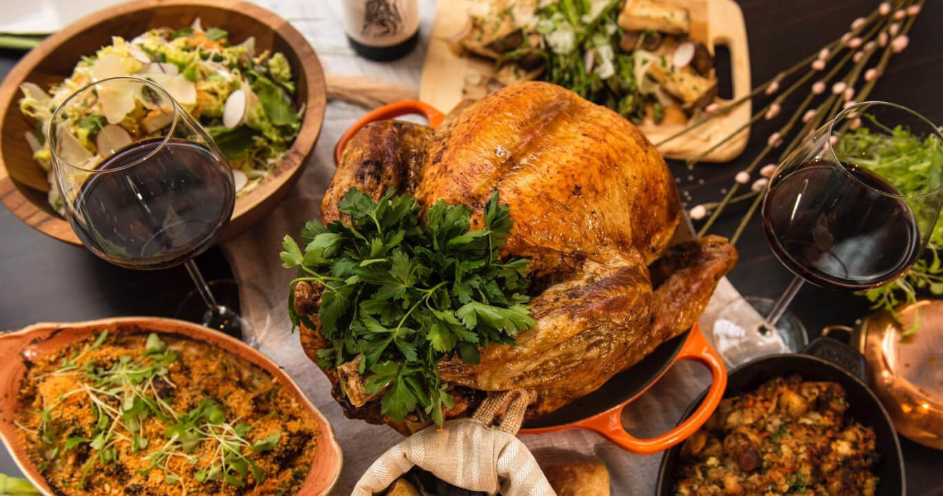 Braised turkey with green herbs and glasses of red wine