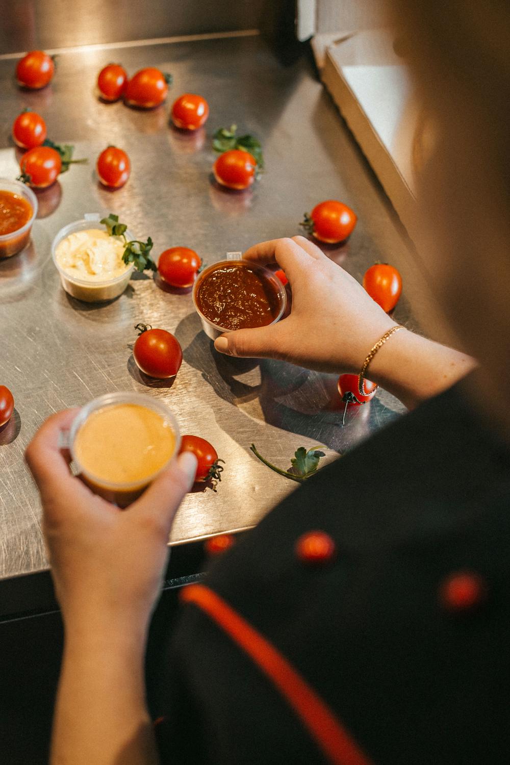 person holding dipping sauce