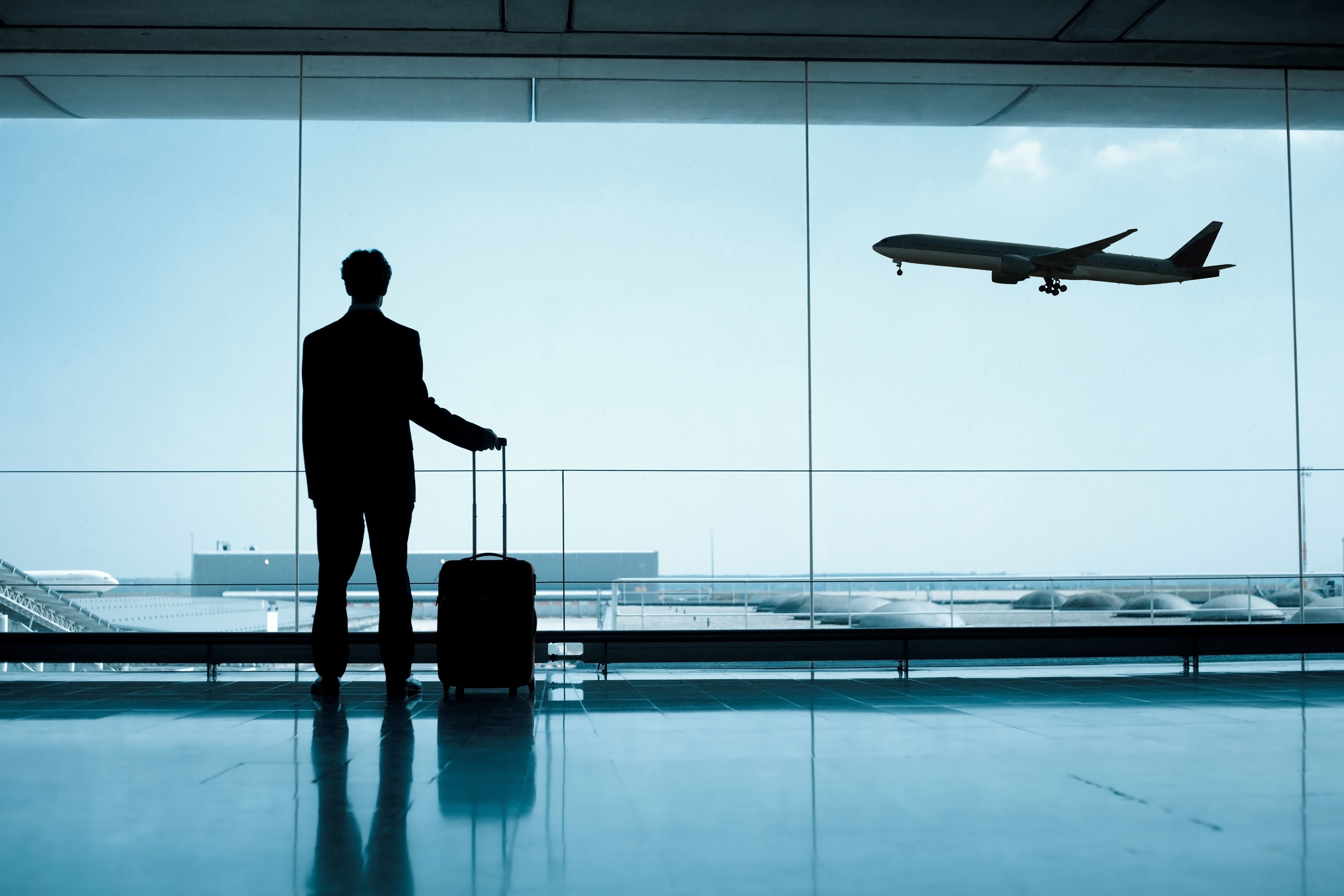 A male passenger at an airport
