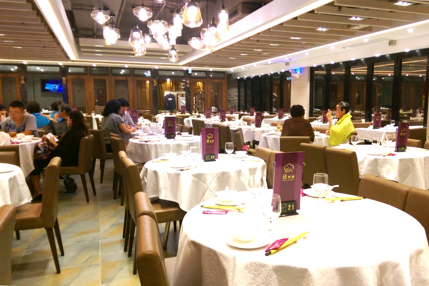 people at a large dinning in Asia