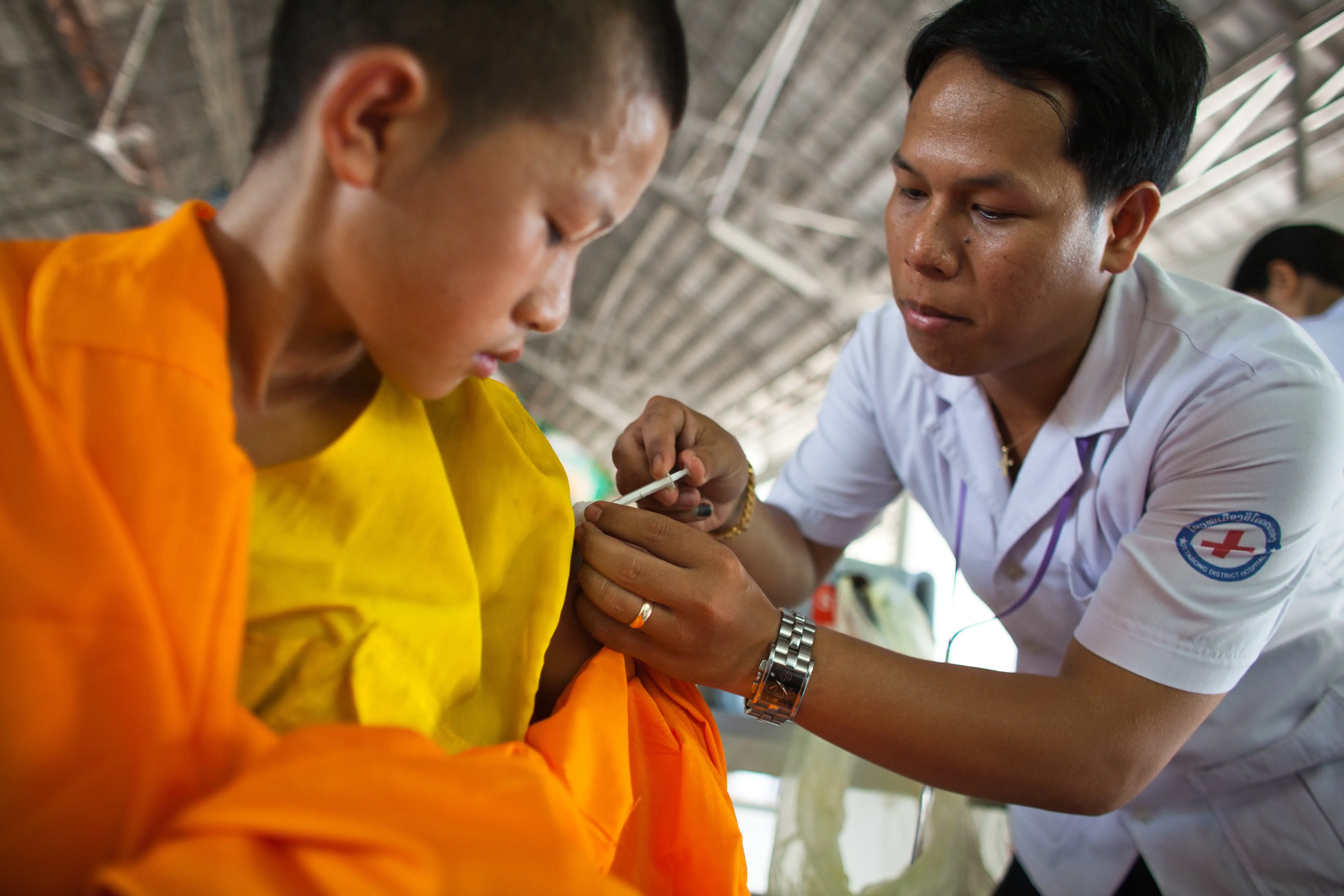 A teenager being vaccinated