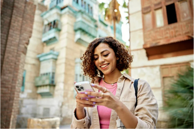 A woman on her Iphone