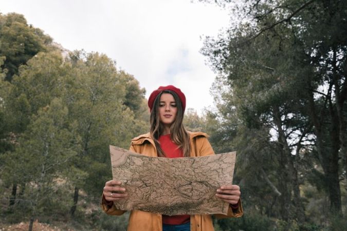 Woman reading a paper map