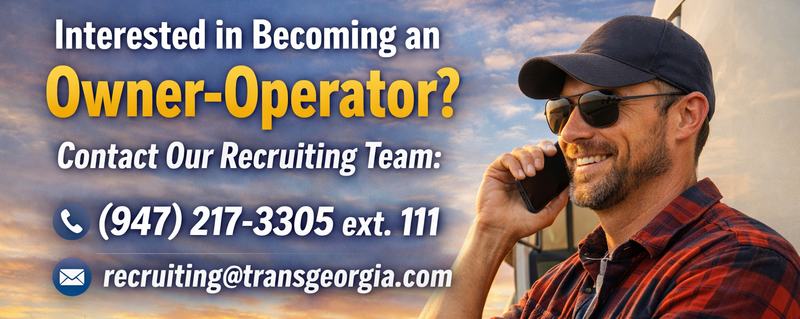 Professional truck driver speaking on the phone beside his truck, representing owner-operator recruiting opportunity with TRANSGEORGIA and highlighting independence, strong support, and direct contact with the recruiting team.